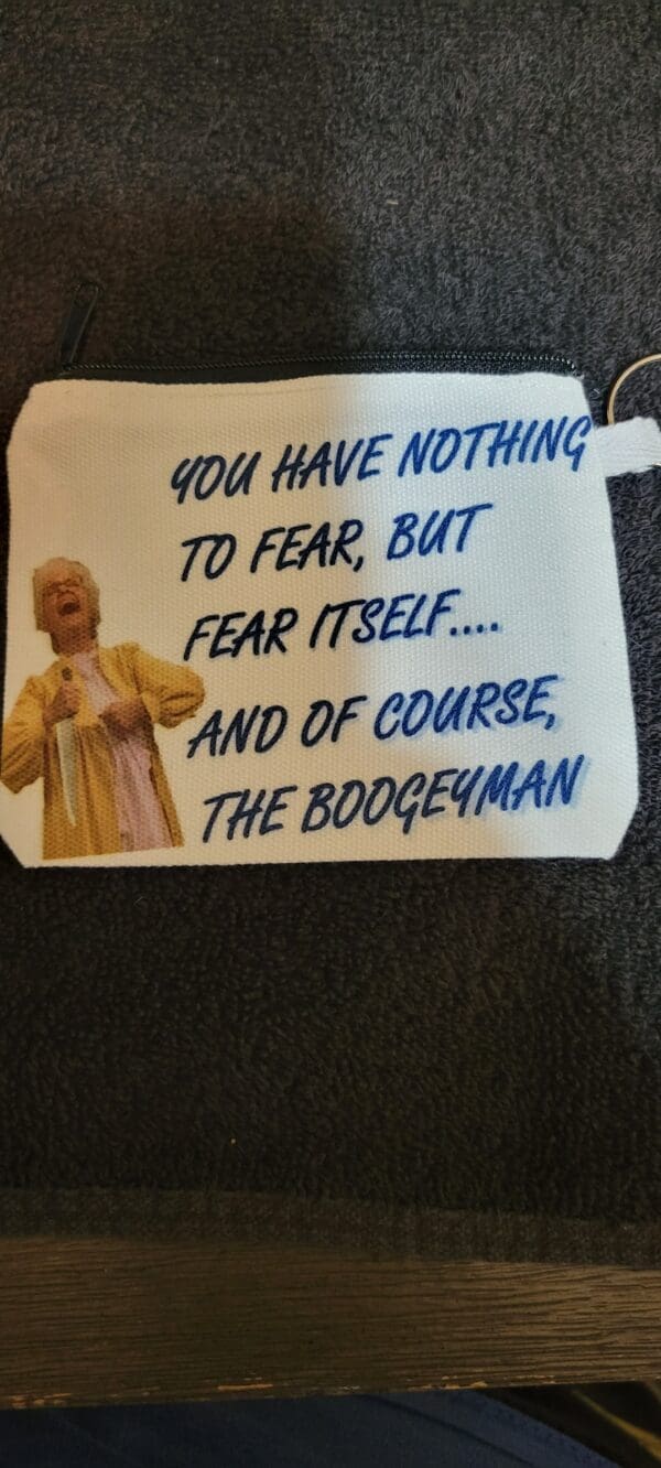 A towel with a quote from the movie, dumb and dumber to.