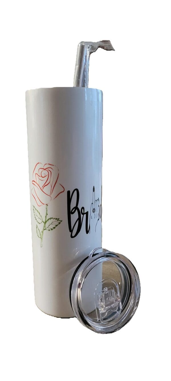 A white thermos with pink and green roses on it.