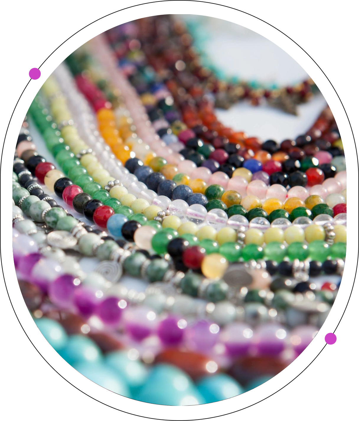 A close up of many different colored beads