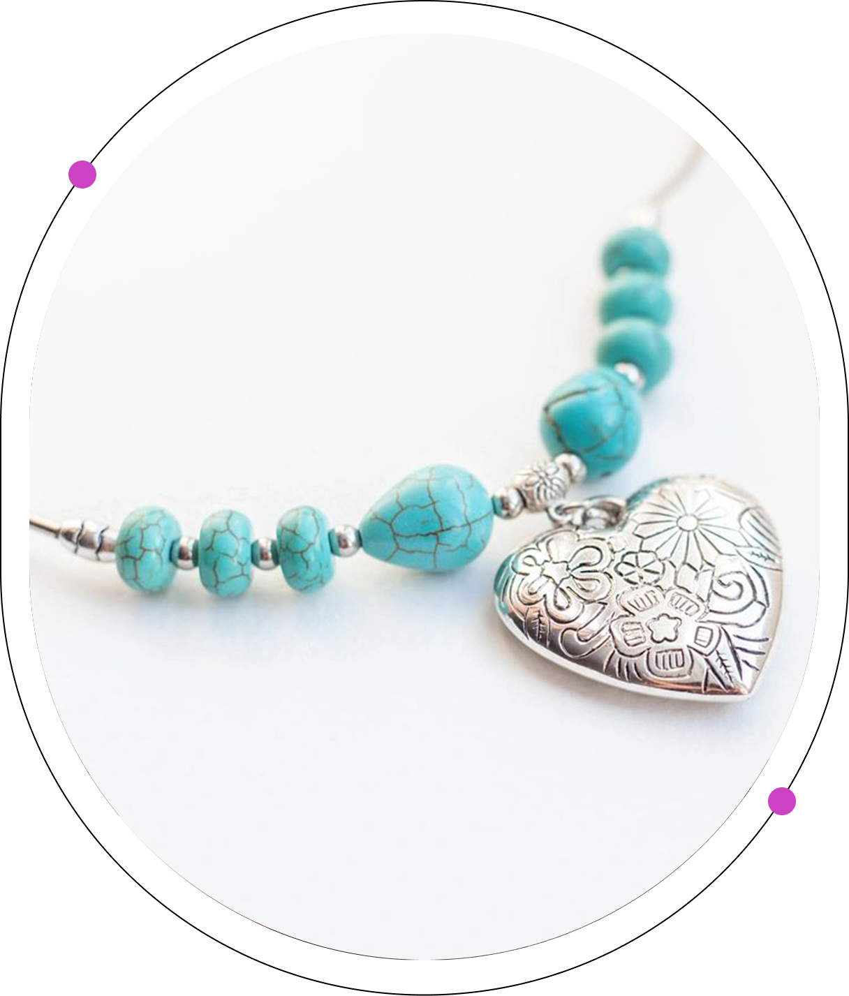 A close up of a necklace with a heart pendant