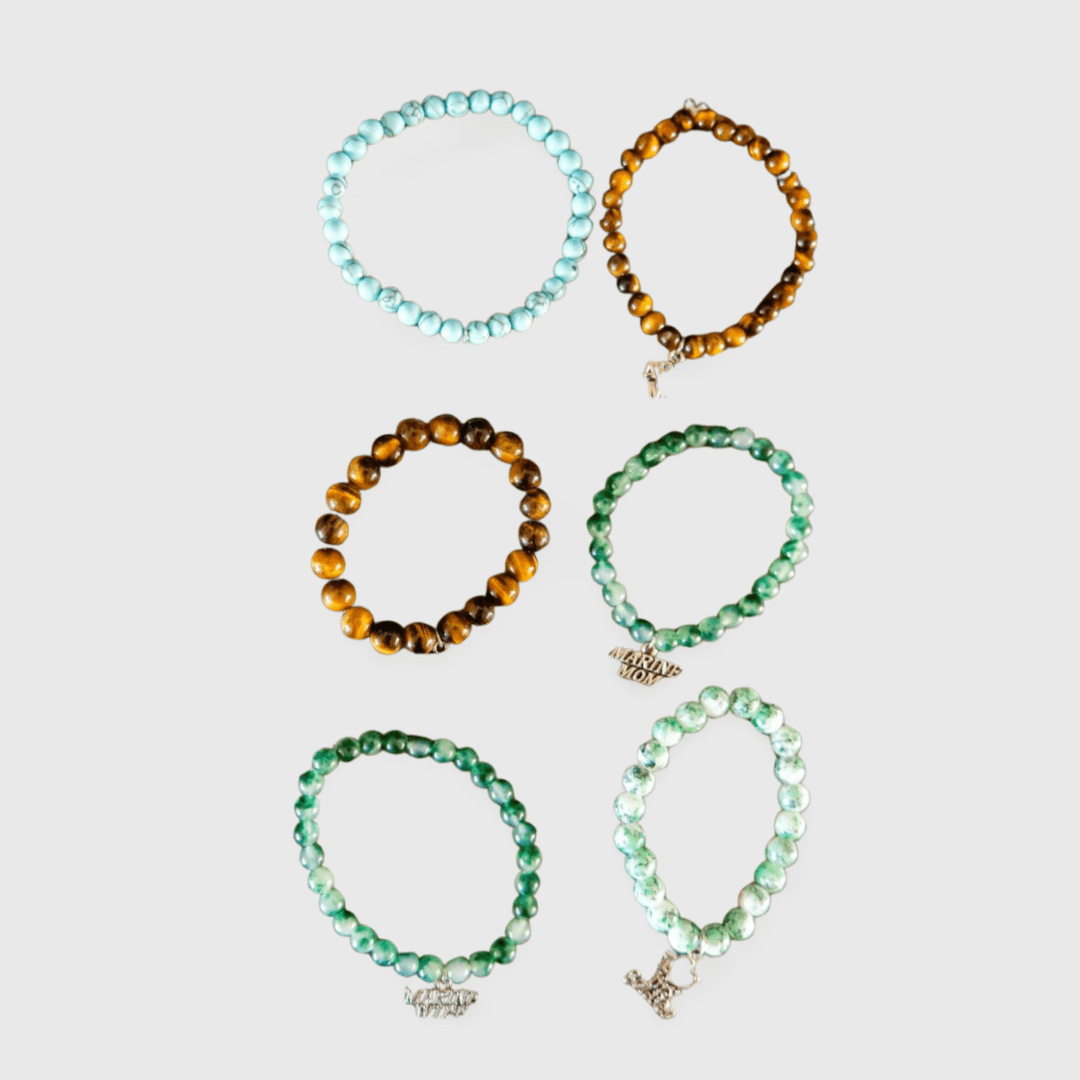 A set of six bracelets with different colors and designs.