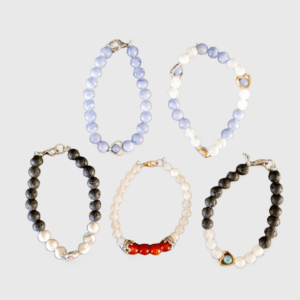 A group of five bracelets that are all different colors.