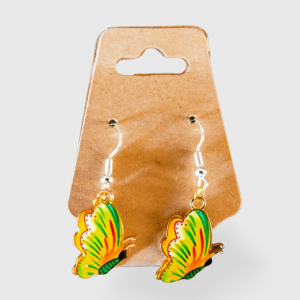 A pair of earrings hanging on a card.