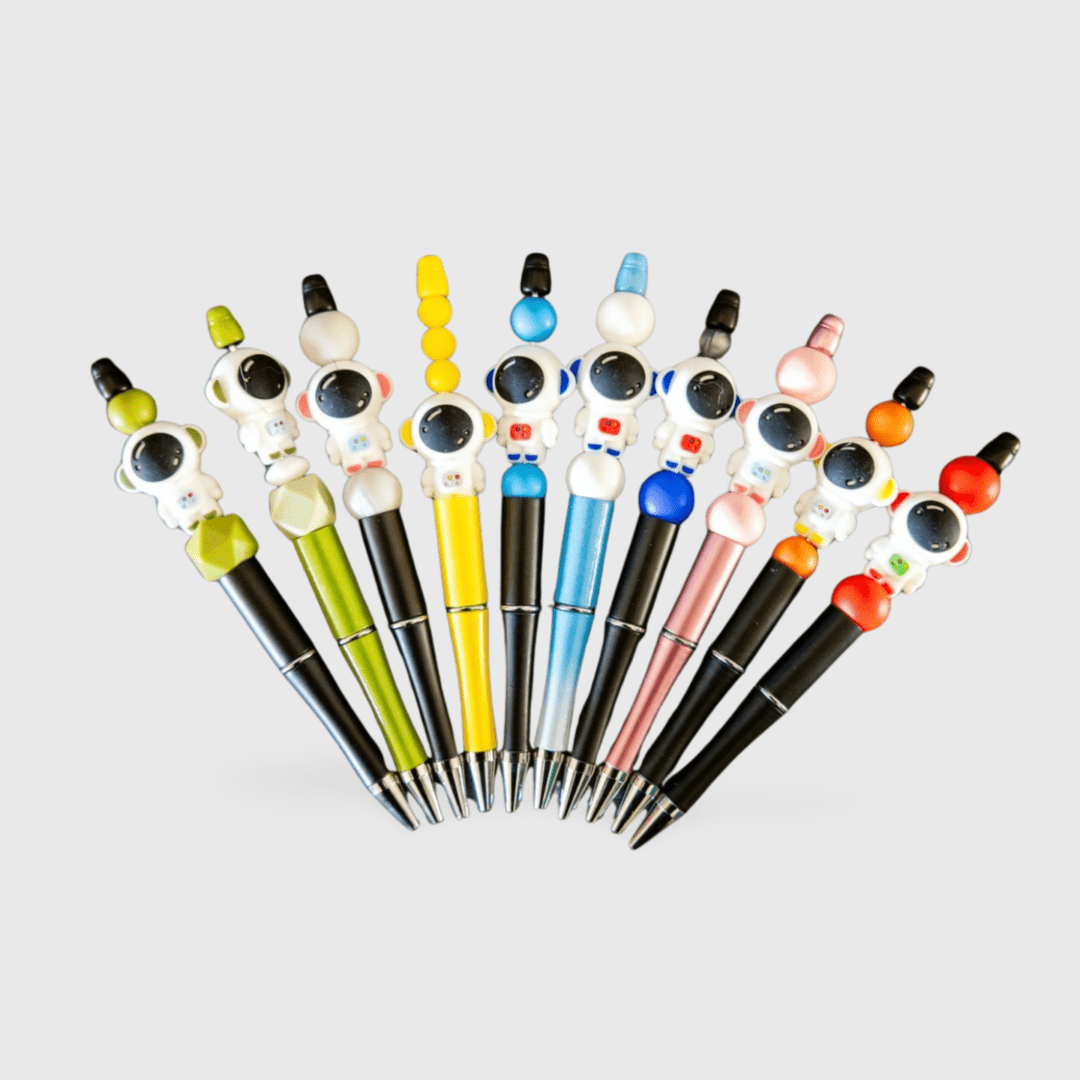 A bunch of pens that are on top of each other