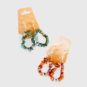 A pair of earrings with different colored beads.