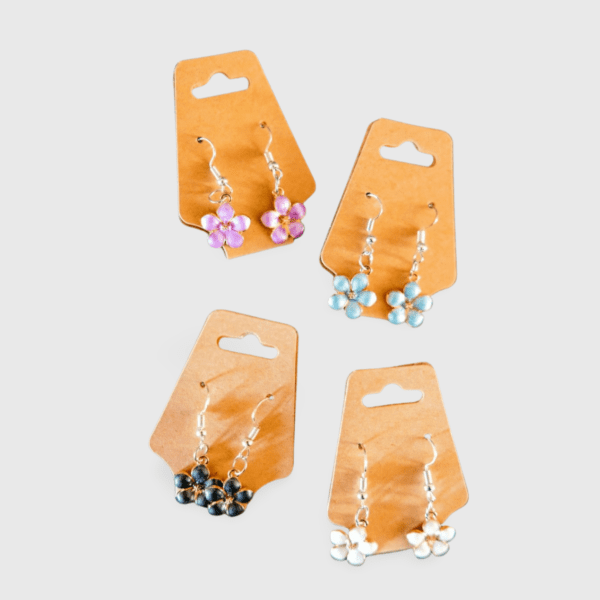 A set of four pairs of earrings hanging on cards.