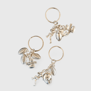 A set of three key chains with different charms.