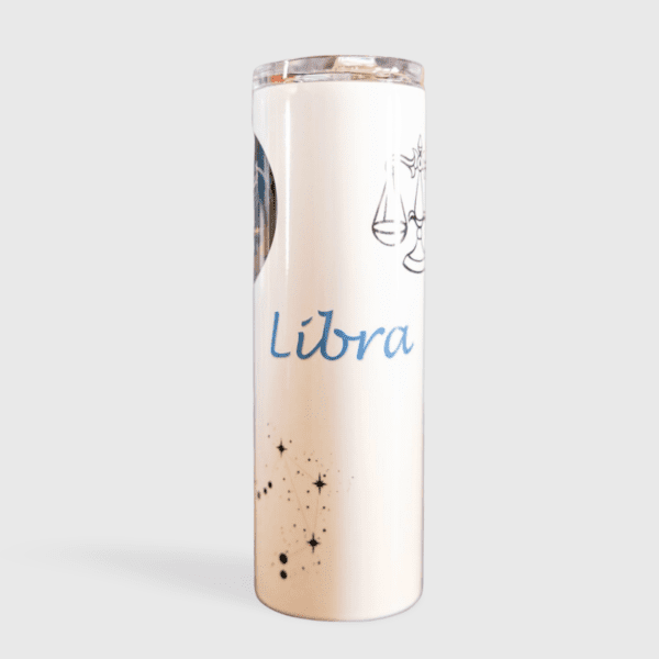 A white tumbler with libra written on it.