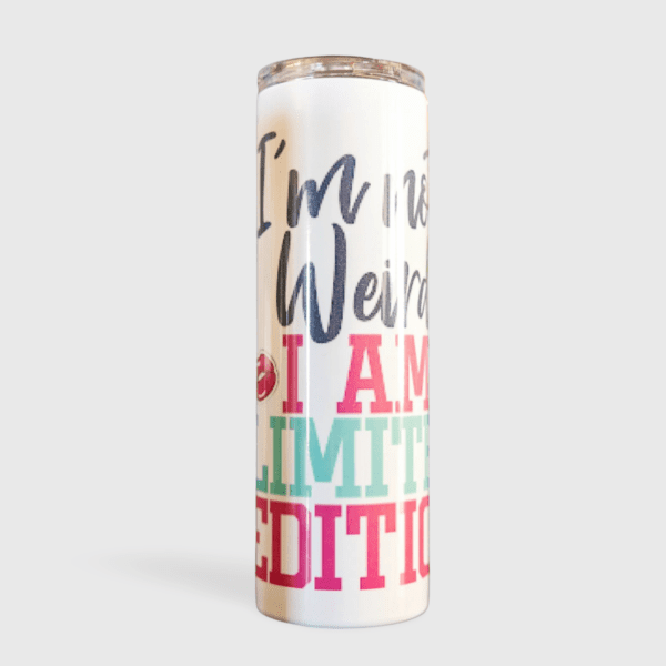 A white candle with the words " i 'm not weird, i am limited edition ".