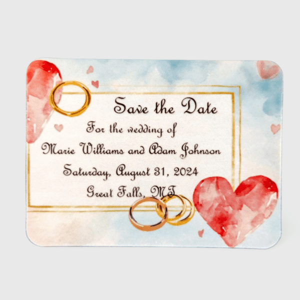 A wedding save the date card with hearts and rings.