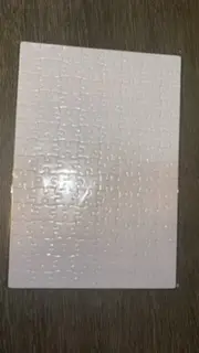 A white sheet of paper with a pattern on it.