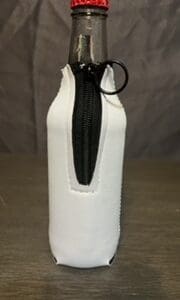 A white bottle with a black zipper on top of it.