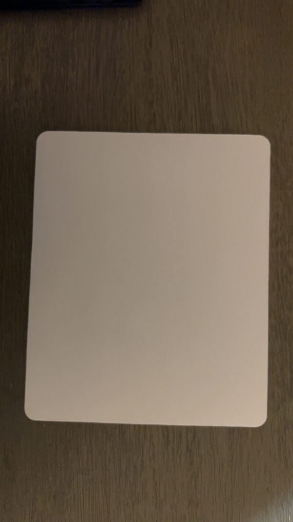 A white card on top of a wooden table.