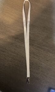 A white plastic fork on top of a table.