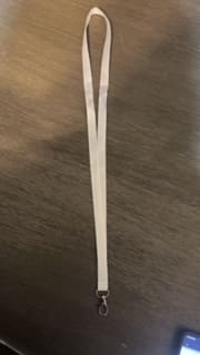 A white plastic fork on top of a table.