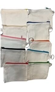 A bunch of different colored zippers on some bags