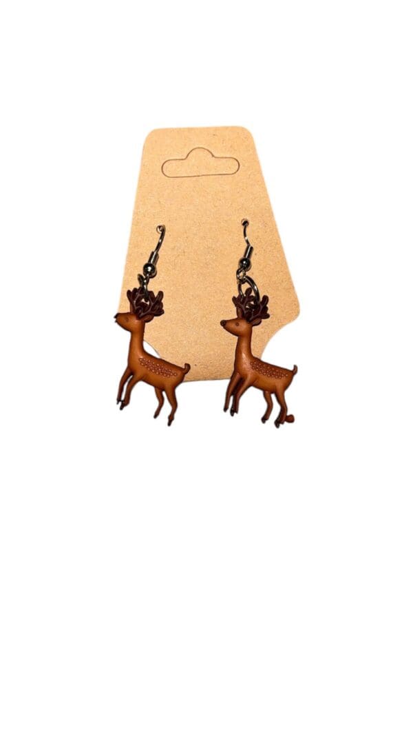 A pair of earrings with deer on them.