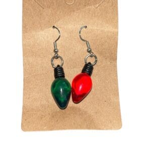 A pair of earrings hanging on a card.